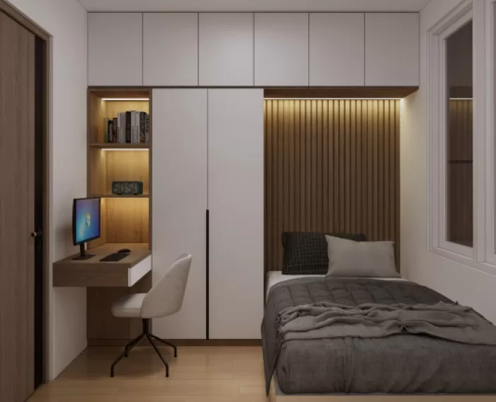 Um quarto com cama de solteiro e móveis planejados.